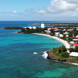 Caribbean Holidays, Active Caribbean Holidays, Aerial view of turquoise Caribbean sea, rugged coastline and a colourful coastal town, bright natural light