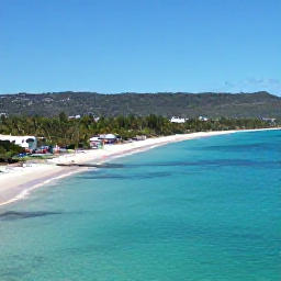 Caribbean Holidays, Antigua Honeymoons, Aerial view of Antigua coastline with turquoise bays, white beaches and green hills under a clear blue sky