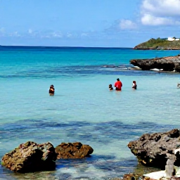 Caribbean Holidays, Antigua July Beaches, Snorkellers exploring clear Caribbean water beside an Antigua beach, with colourful fish, coral and rocky coastline