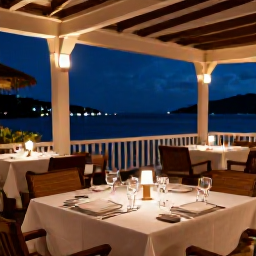 Caribbean Holidays, Antigua Luxury December, A stylish Caribbean restaurant in Antigua serving an elegant dinner on a terrace overlooking the sea at night