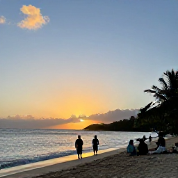 Caribbean Holidays, Antigua October Festivals, Quiet Antiguan beach at sunset with a small group of travellers enjoying the October evening