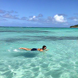 Caribbean Holidays, Antigua Solo Holidays, Solo traveller swimming and snorkelling in clear turquoise water beside a calm Antigua beach