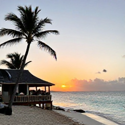 Caribbean Holidays, April Adventures, Relaxed Cura&ccedil;ao beach at sunset with calm turquoise water, palm trees and a small beachside restaurant