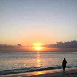 Caribbean Holidays, April Instagram Spots, Sunset over Long Bay Beach in Turks and Caicos, with calm water, gentle waves and a person walking along the shore