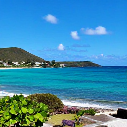 Caribbean Holidays, April Nature Holidays, A bright coastal view of Saint Martin and Sint Maarten in April, with turquoise sea, green hills and a clear blue sky
