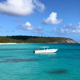 Caribbean Holidays, April Scuba Diving, A small dive boat travelling across calm turquoise water beside Antigua's green coastline