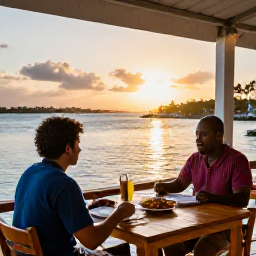 Caribbean Holidays, April Solo Holidays, A solo traveller dining at a small waterfront restaurant in Bequia at sunset, fresh Caribbean food, harbour views and relaxed atmosphere