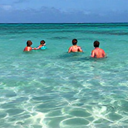 Caribbean Holidays, Aruba Beach Holidays, Travellers snorkelling in clear shallow water at Baby Beach Aruba, colourful fish, sandy seabed and bright Caribbean sunshine