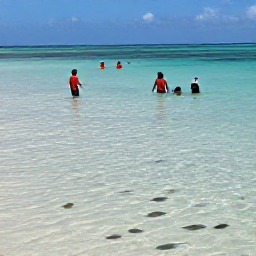 Caribbean Holidays, Aruba Beach Holidays, Visitors snorkelling in clear shallow water at Baby Beach, Aruba, colourful fish, sandy seabed and sunny weather