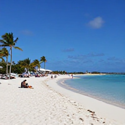 Caribbean Holidays, Aruba February Business Class, White sandy Palm Beach in Aruba with calm turquoise water, palm trees and visitors enjoying February sunshine