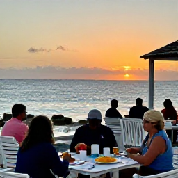 Caribbean Holidays, Aruba in January, A relaxed beachfront restaurant in Aruba at sunset in January, with diners enjoying Caribbean food, soft evening light and the sea beyond