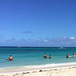 Caribbean Holidays, Aruba in January, Aruba beach in January with snorkellers, paddleboarders and clear Caribbean water under a blue sky