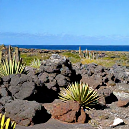 Caribbean Holidays, Aruba in September, Arikok National Park landscape in Aruba with rugged volcanic rocks, cacti, desert plants and a distant blue sea