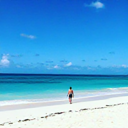 Caribbean Holidays, Aruba January Holidays, Solo traveller walking along a bright white sandy beach in Aruba in January, calm turquoise sea and clear blue sky
