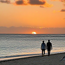 Caribbean Holidays, Aruba March Holidays, A couple walking along an Aruba beach at sunset, with orange light over the sea and a relaxed Caribbean atmosphere