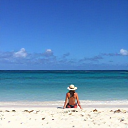 Caribbean Holidays, Aruba Solo Holidays, Solo traveller relaxing on a bright white beach in Aruba beneath a clear blue February sky
