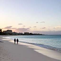 Caribbean Holidays, Aruba Walking Holidays, A peaceful walker on Eagle Beach at sunset, with white sand, calm turquoise water and Aruba's characteristic low-rise coastline