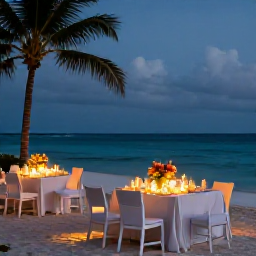 Caribbean Holidays, Aruba Weddings, A wedding reception on an Aruba beach at twilight with softly lit tables, tropical flowers and the Caribbean Sea