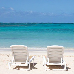 Caribbean Holidays, Aruba Wellness Break, Palm-fringed Aruban beach with a comfortable sun lounger, clear shallow sea and a quiet atmosphere