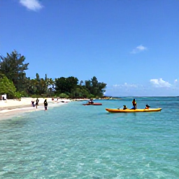Caribbean Holidays, August Adventure, Kayakers and snorkellers exploring clear turquoise water beside a tropical beach in Saint Kitts and Nevis
