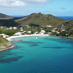 Caribbean Holidays, August Adventures, A bright aerial view of Saint Barth&eacute;lemy in August, showing turquoise bays, green hills and a sailing boat near the coast