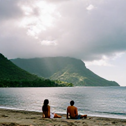 Caribbean Holidays, August Couples Holidays, Couple relaxing on a quiet Montserrat coastline after a light tropical shower, with sunshine breaking through clouds and green hills behind