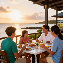 Caribbean Holidays, August Family Holidays, Family enjoying an outdoor Caribbean restaurant at sunset in Providenciales, fresh seafood, relaxed seating and warm evening light
