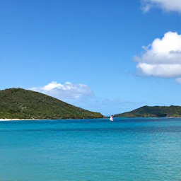 Caribbean Holidays, August Island Hopping, A bright Caribbean island coastline in August, showing Saint Kitts and Nevis with calm turquoise sea, green hills and a small sailing boat