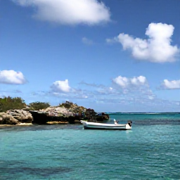 Caribbean Holidays, August Nature Holidays, A small boat exploring the calm turquoise waters around Tintamarre and Pinel Island in August, with seabirds, rocky coastline and bright Caribbean sunshine