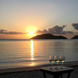 Caribbean Holidays, August Wine Tasting, Sunset over a calm Caribbean beach in the United States Virgin Islands, with wine glasses on a small table in the foreground