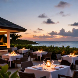 Caribbean Holidays, Bahamas Adults Only June, Elegant adults-only resort dining terrace in The Bahamas at sunset, with tropical plants, softly lit tables and ocean views