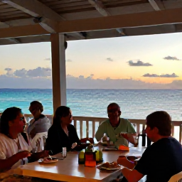 Caribbean Holidays, Bahamas Beach Holidays, A relaxed beachfront restaurant in Nassau at sunset, with diners enjoying Bahamian food and views across the sea