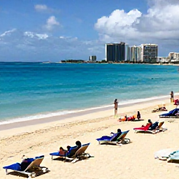 Caribbean Holidays, Bahamas Beach Holidays, Visitors relaxing on Cable Beach in Nassau, with bright blue sea, golden sand, sun loungers and a distant resort skyline
