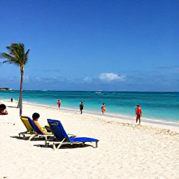 Caribbean Holidays, Bahamas Business Class, Cable Beach in Nassau with soft white sand, clear turquoise water, sun loungers, palm trees, and visitors enjoying a peaceful January beach day