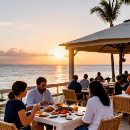 Caribbean Holidays, Bahamas February Holidays, Elegant beachfront restaurant in The Bahamas at sunset with fresh seafood and relaxed diners