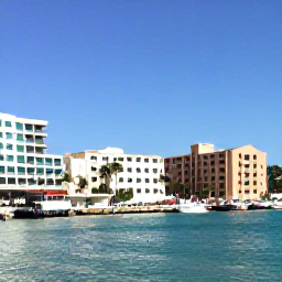 Caribbean Holidays, Bahamas February, Sunny Nassau waterfront in February with pastel buildings, palm trees, clear turquoise water and visitors strolling along the harbour