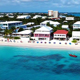 Caribbean Holidays, Bahamas Instagram Hotspots, Aerial view of Nassau&rsquo;s clear blue water, white sand, colourful beach umbrellas and historic waterfront buildings in The Bahamas