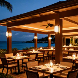Caribbean Holidays, Bahamas Luxury Holidays, Sophisticated outdoor restaurant in Nassau, Bahamas, serving fresh seafood at dusk with warm lighting and relaxed diners