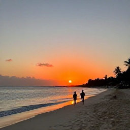 Caribbean Holidays, Bahamas Nature Holidays, Peaceful Bahamian beach at sunset with a couple walking along the shoreline and palm trees in the distance