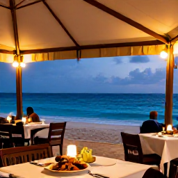 Caribbean Holidays, Barbados Adventure Holidays, A relaxed evening at a Barbados beachside restaurant with local food, warm lights and the sea beyond