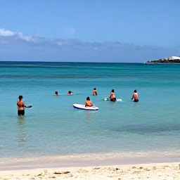 Caribbean Holidays, Barbados All Inclusive, Visitors swimming and paddleboarding in clear Caribbean water off a Barbados beach