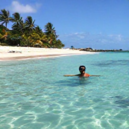Caribbean Holidays, Barbados Backpacking, Backpacker snorkelling in clear calm water near Barbados, palm-fringed beach, colourful fish and reef scenery