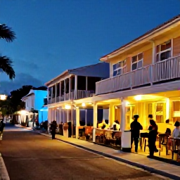 Caribbean Holidays, Barbados City Breaks, Evening street scene in Bridgetown Barbados with live music, warmly lit restaurants and visitors enjoying the nightlife