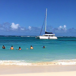 Caribbean Holidays, Barbados Cruises, Travellers swimming and snorkelling in clear blue water beside a catamaran off a sandy Barbados beach