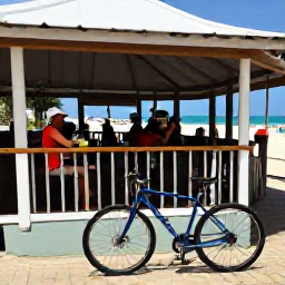Caribbean Holidays, Barbados Cycling March, Cyclist enjoying a beachfront refreshment at a friendly Barbados caf&eacute;, bicycle resting nearby