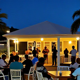Caribbean Holidays, Barbados February, Evening in Bridgetown, Barbados, with warmly lit restaurants, live music and visitors enjoying a safe lively Caribbean atmosphere