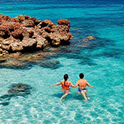 Caribbean Holidays, Barbados Honeymoons, Couple swimming and snorkelling in clear turquoise water beside a colourful coral reef in Barbados