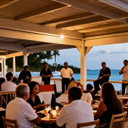 Caribbean Holidays, Barbados in February, Relaxed evening in Barbados with diners enjoying local music at an outdoor restaurant near the coast under warm lights