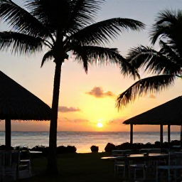 Caribbean Holidays, Barbados in September, Barbados evening nature scene with a sunset over the coast, warm sky, palm silhouettes and a relaxed outdoor restaurant