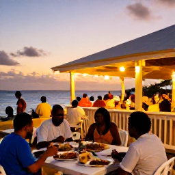 Caribbean Holidays, Barbados January Breaks, Outdoor table serving Bajan food in a lively Bridgetown restaurant at sunset, with local people and warm island lighting